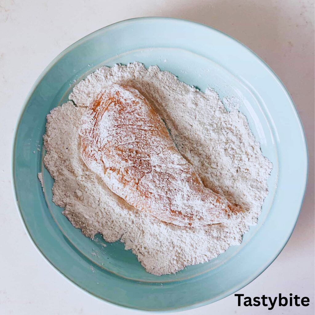 Chicken breast covered in flour