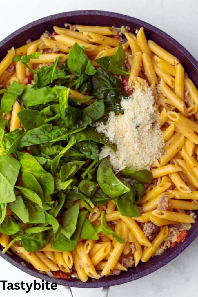 Stirring in the spinach and parmesan