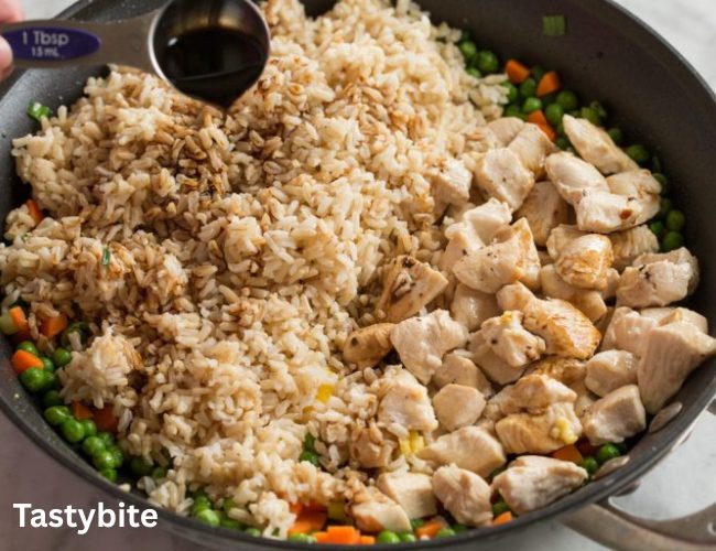 Adding Rice to vegetables and chicken