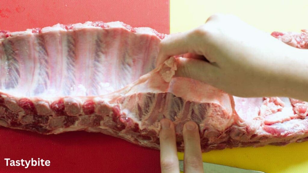 Removing the membrane from the ribs
