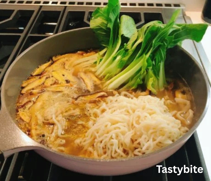 Adding noodles and vegetables