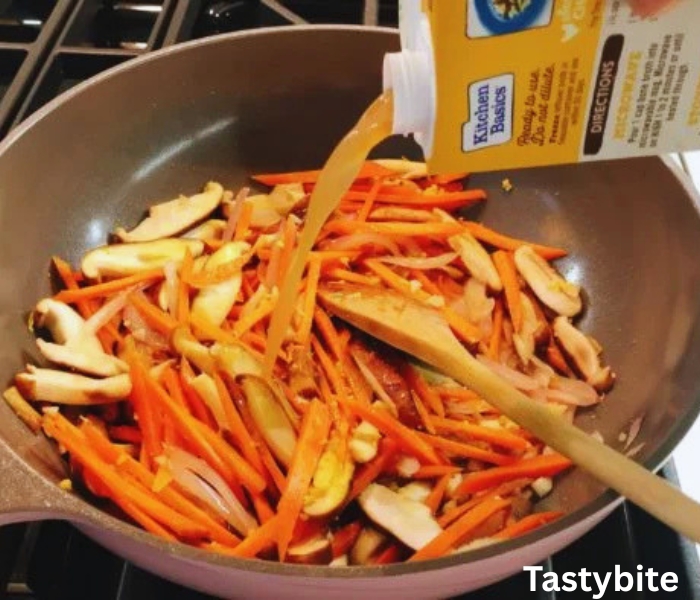 Sauting shallot and carrot, and adding chicken broth
